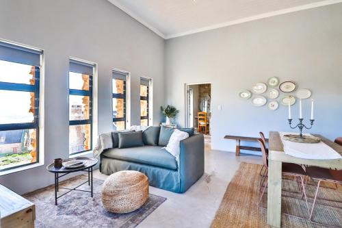 a living room with a blue couch and a table at The Castle in McGregor