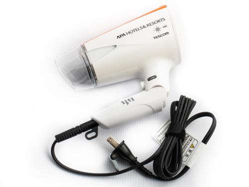 a hair dryer with a cord and a blow dryer at APA Hotel TKP Sendai Eki Kita in Sendai