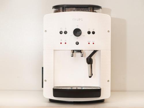 a white coffee machine sitting on a counter at At the Blue Lion & Parking Assistance in Prague