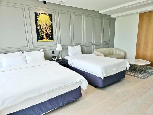 Postel nebo postele na pokoji v ubytování Suncheon Hotel Gite
