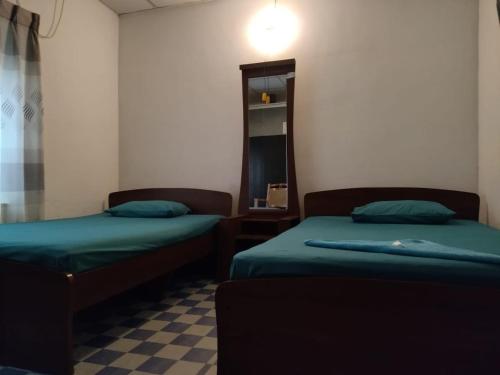 Postel nebo postele na pokoji v ubytování Walawwa Resort