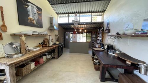 a large kitchen with wooden counter tops and a counter top at Inglenook Chic in Yzerfontein