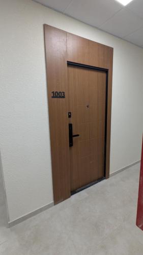 a door in an office with the word loops on it at Gizo apartments in Batumi