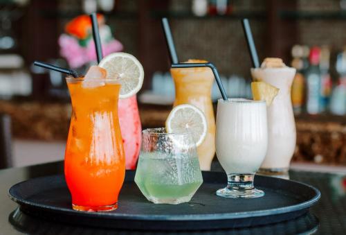 a tray with four drinks on a table at Toyoko Inn Cebu in Cebu City