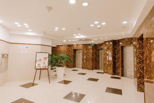 a lobby with a sign in the middle of a building at Toyoko Inn Cebu in Cebu City