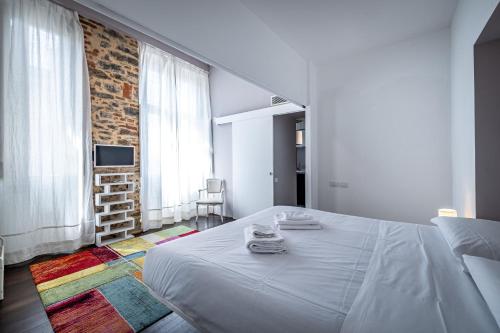 Posteľ alebo postele v izbe v ubytovaní Roommo Fortezza