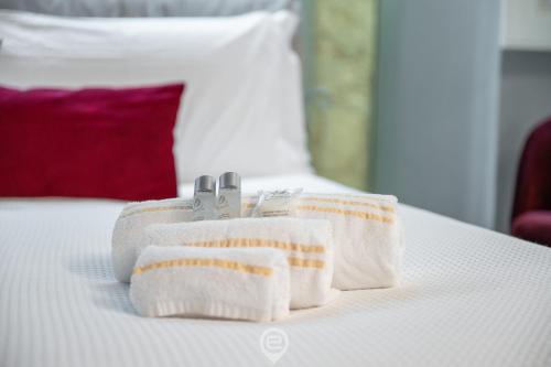 Кровать или кровати в номере Amo Castle Rooms