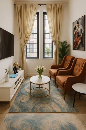 a living room with two couches and a tv at Lekki Luxe 4BR Retreat in Ikota
