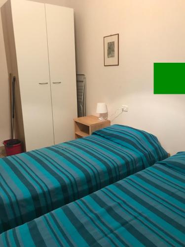 Ένα ή περισσότερα κρεβάτια σε δωμάτιο στο Giardinetto