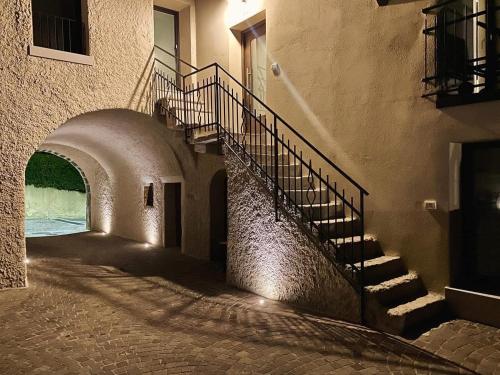 a stairway leading to a building with a stair case at Villetta Moscal - Buon Gusto in Affi