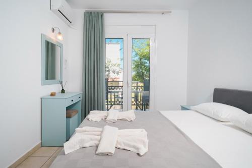 Ένα ή περισσότερα κρεβάτια σε δωμάτιο στο Green Apartments