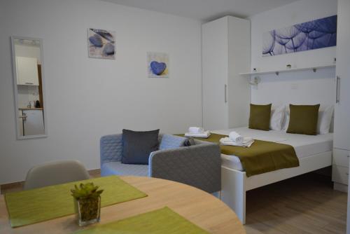 Postel nebo postele na pokoji v ubytování Sunny Day apartments