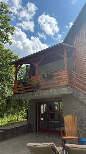 a house with a deck on top of it at Vila Vera in Vršac