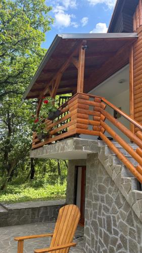 a wooden deck on the side of a house at Vila Vera in Vršac