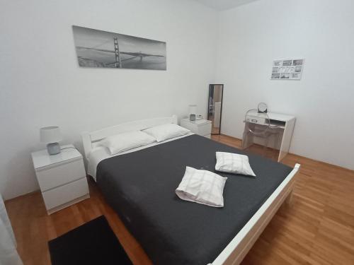 Postel nebo postele na pokoji v ubytování Apartment Greta