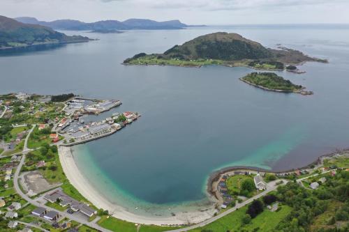 an aerial view of a group of islands in a body of water at Stavetunet in Stadlandet