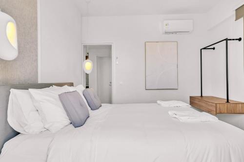 Ένα ή περισσότερα κρεβάτια σε δωμάτιο στο Olearia Villas