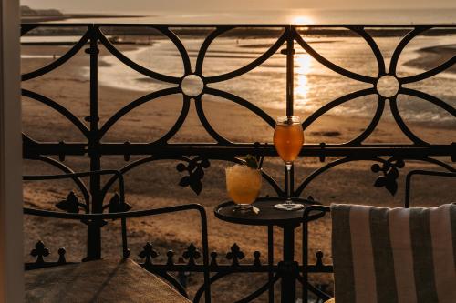 a view from a balcony with two drinks on a table at No 42 by GuestHouse, Margate in Margate
