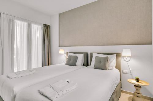 Ένα ή περισσότερα κρεβάτια σε δωμάτιο στο Olearia Villas