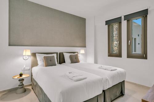 Ένα ή περισσότερα κρεβάτια σε δωμάτιο στο Olearia Villas