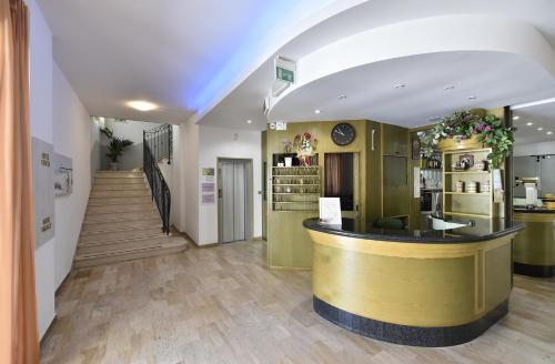 a store lobby with a counter and a staircase at Hotel Fiorita in Bellaria-Igea Marina