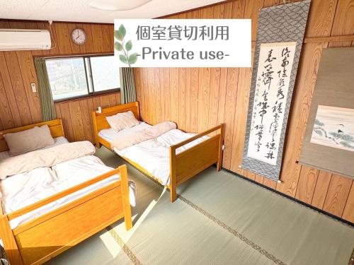 AKARIYA Hostelにあるベッド