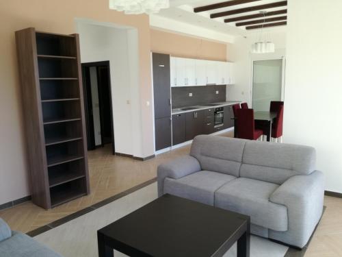 a living room with a couch and a table at Villa Smokovac in Risan