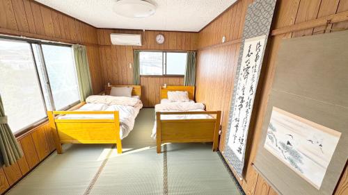 AKARIYA Hostelにあるベッド