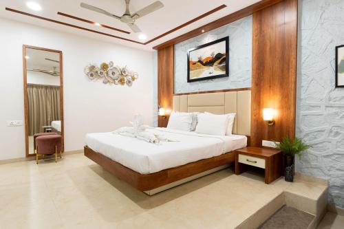 Postel nebo postele na pokoji v ubytování Visava Amusement Park & Resort Navi Mumbai