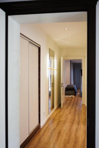 an open door into a room with a bedroom at Апартаменти в центрі Шаян in Shaian