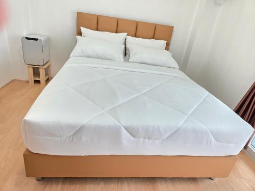 Ένα ή περισσότερα κρεβάτια σε δωμάτιο στο Loft2s Rangsit