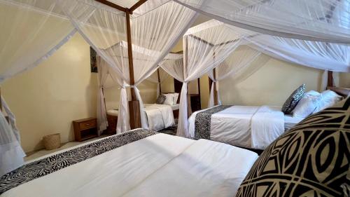 Postel nebo postele na pokoji v ubytování Ultra Home Hostel