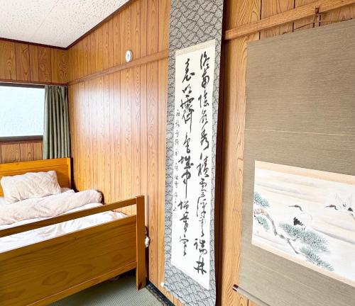 AKARIYA Hostelにあるベッド