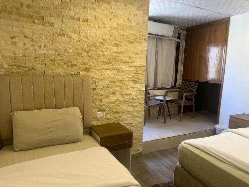 Ένα ή περισσότερα κρεβάτια σε δωμάτιο στο Cairo downtown jordan hotel