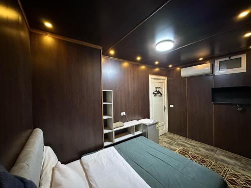 a bedroom with a bed and a sink in it at Cheers Hostel Cairo in Cairo