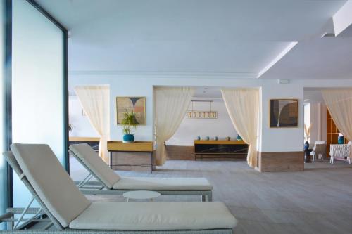 a living room with two chairs and a couch at Hilton Skanes Monastir Beach Resort in Monastir