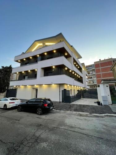 a black car parked in front of a building at La casa di Loryanne in Avezzano
