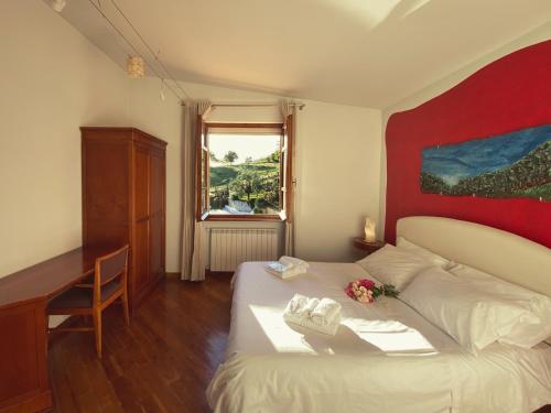 Ένα ή περισσότερα κρεβάτια σε δωμάτιο στο Agriturismo Le Valli