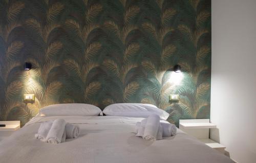 a bedroom with a bed with two towels on it at Agriturismo Il Bagolaro in Nerola