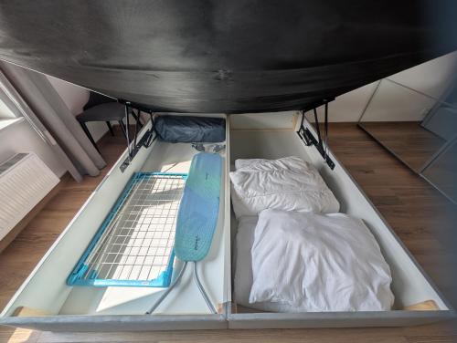a room with a bed and a mattress at Dwupokojowe z osobną kuchnią na osiedlu Przystanek Międzylesie in Warsaw
