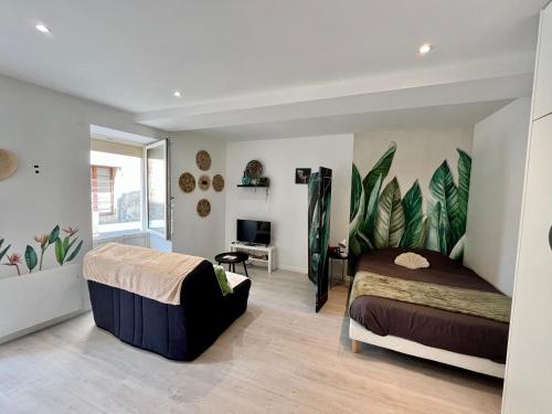 Postel nebo postele na pokoji v ubytování Le p’tit nid des Halles