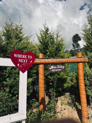 a sign that reads where to next and a sign that says where to at Aden Valley Resort in Kanthalloor