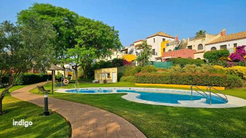 a swimming pool in the middle of a yard at SIM01 Direct Access to Pool Area Las Lomas in Ayamonte