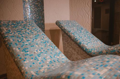 two chairs sitting next to each other in a room at Hotel Lesana in Vysoké Tatry