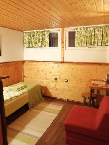 Ένα ή περισσότερα κρεβάτια σε δωμάτιο στο Hotel Korpikartano