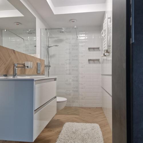 a bathroom with a shower and a sink and a toilet at Pluma in Grzybowo