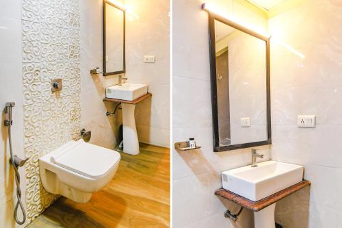 a bathroom with a toilet and a sink and a mirror at FabHotel Suncitel - Nr Netaji Subhash Chandra Bose International Airport in Kolkata
