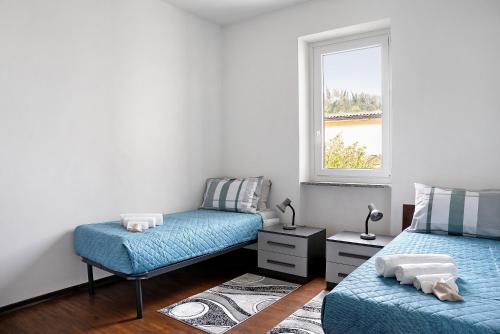 Ένα ή περισσότερα κρεβάτια σε δωμάτιο στο Casa vacanze Nada