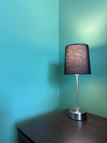 a lamp sitting on top of a wooden table at FinIQ Boutiq Studios in Foiníki
