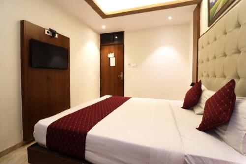 Ένα ή περισσότερα κρεβάτια σε δωμάτιο στο GATEWAY STAR HOTEL
